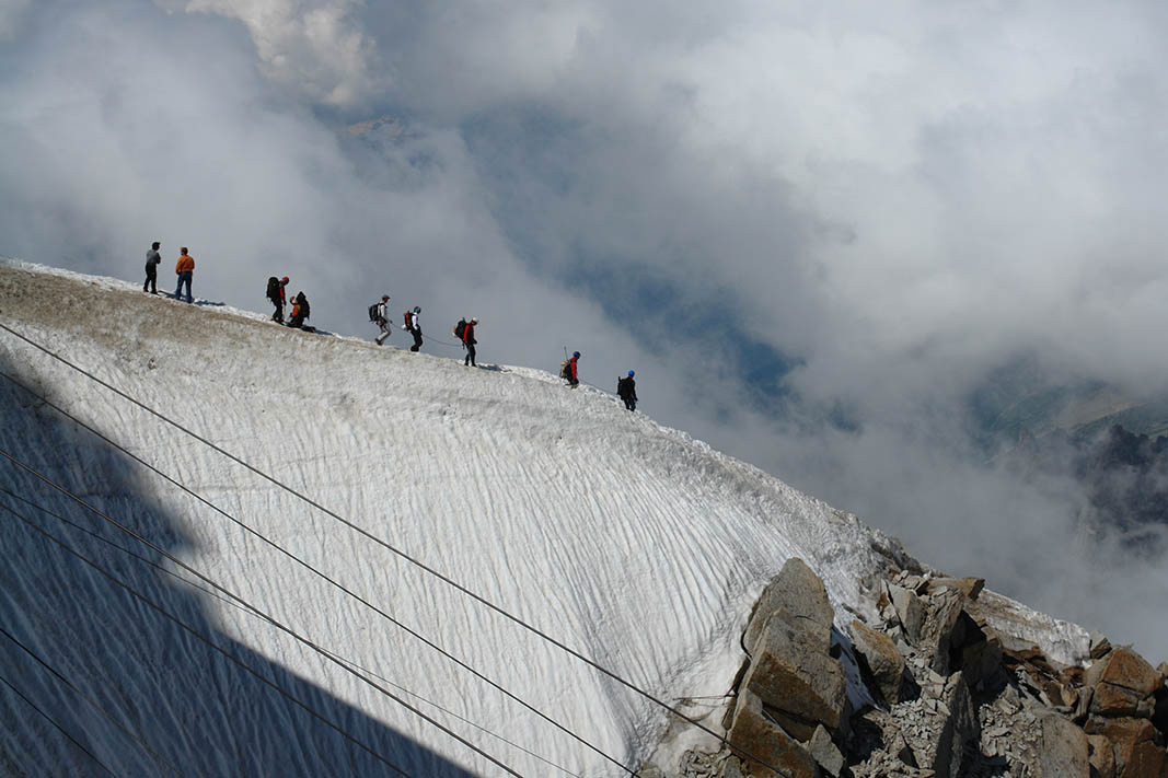 on an edge alpinist alps swiss france mountines extrem
