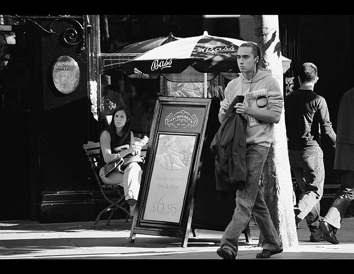 a model & a fashion editor taking notes street fashion cafe soho london