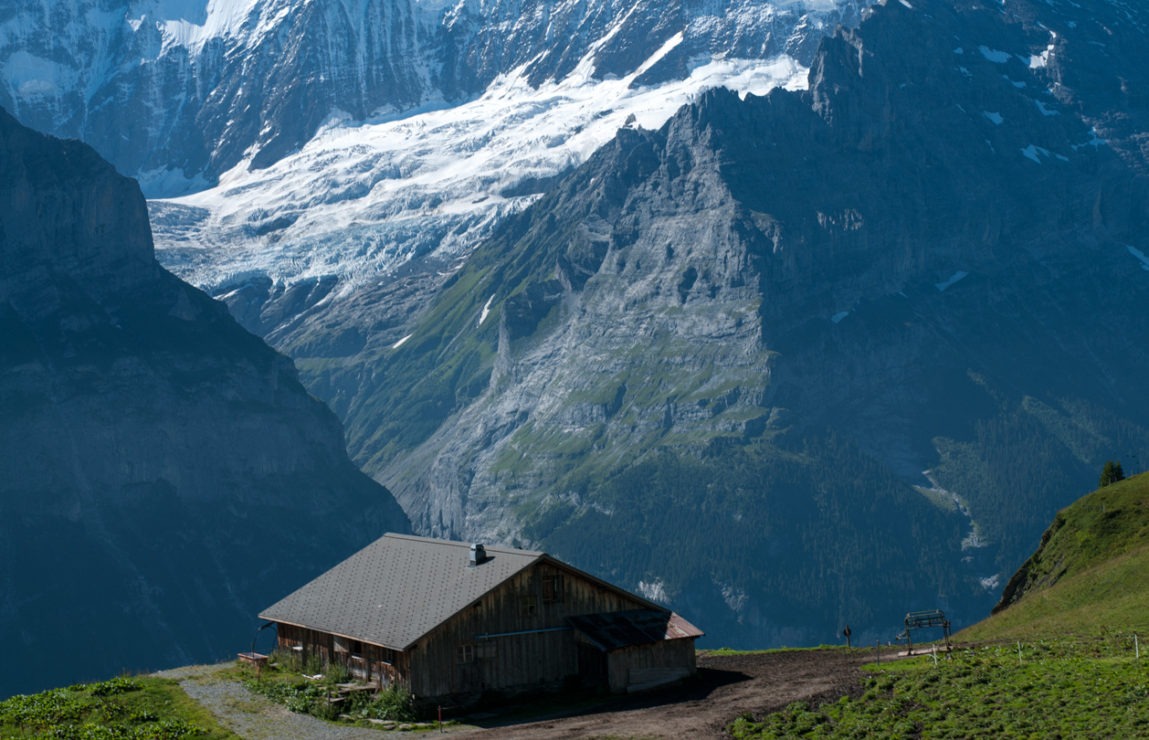 Scrambling along the edge of a cliff Switzerland Grindelwald