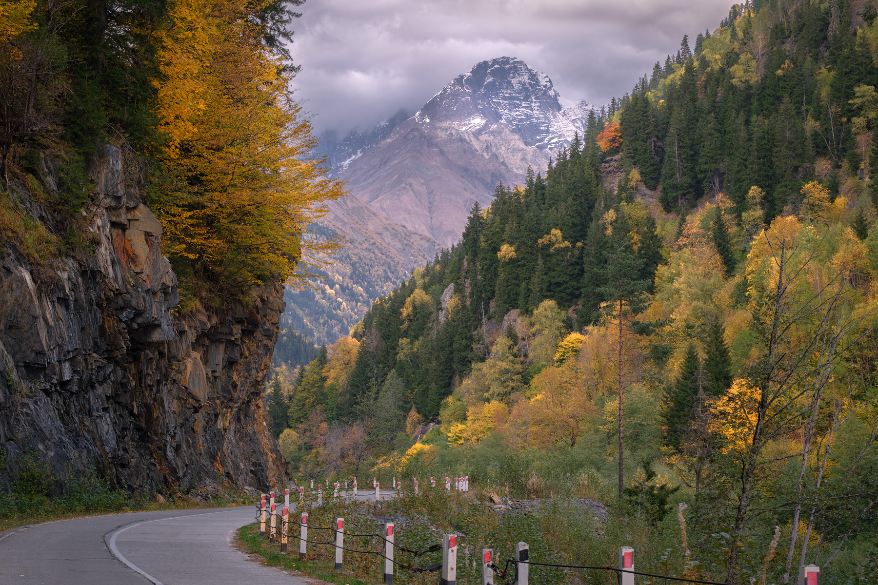 October Road To Koruldashi racha lechkhumi road fall autumn forest trees yellow mountains rocks clouds sky nature landscape scenery travel outdoors georgia sakartvelo chizh
