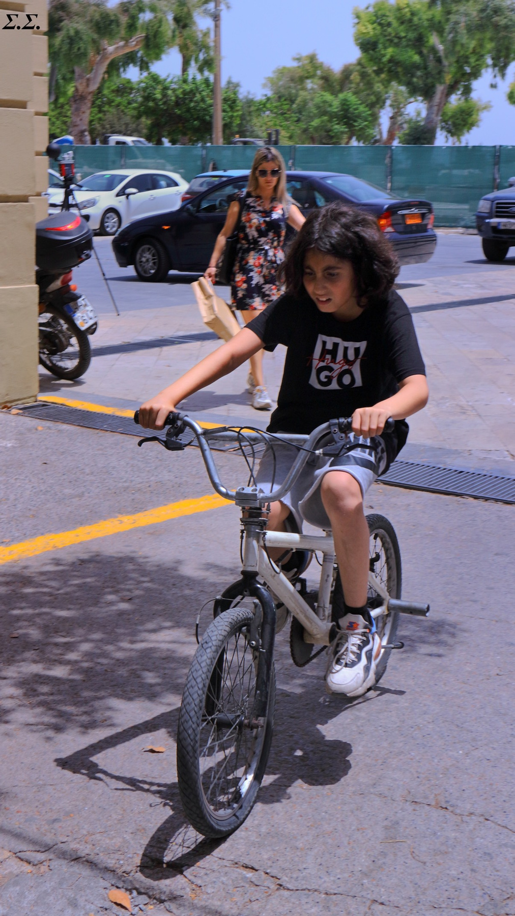 YOUNG CYCLIST IN THE HEAT 