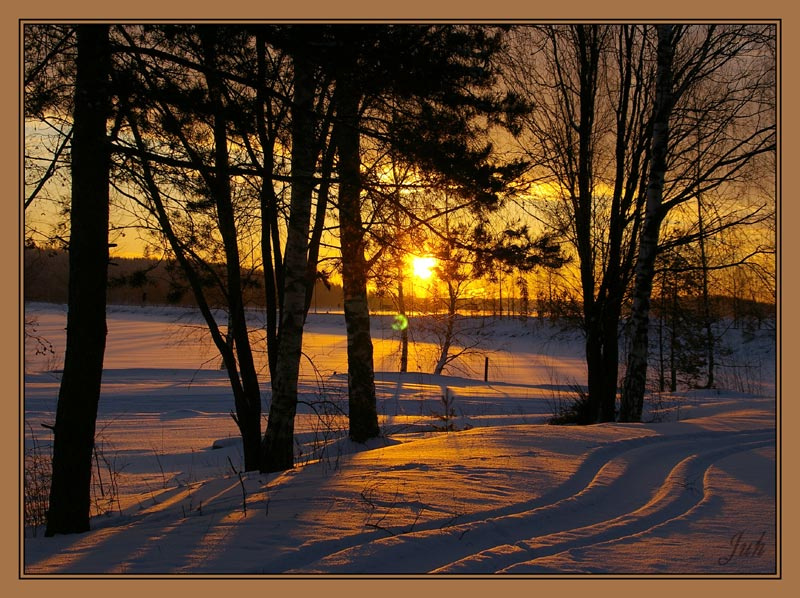 Imatran auringonlasku - kuva yksi poika ja kamera