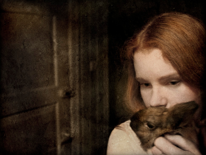a girl with a rabbit 