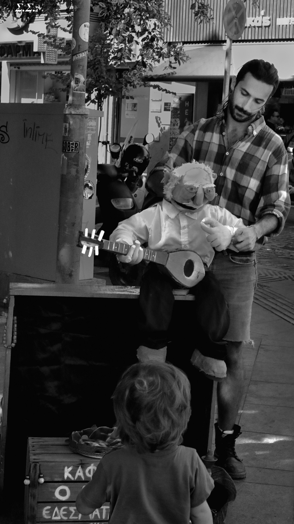 STREET MUSICIAN AND CROWD 