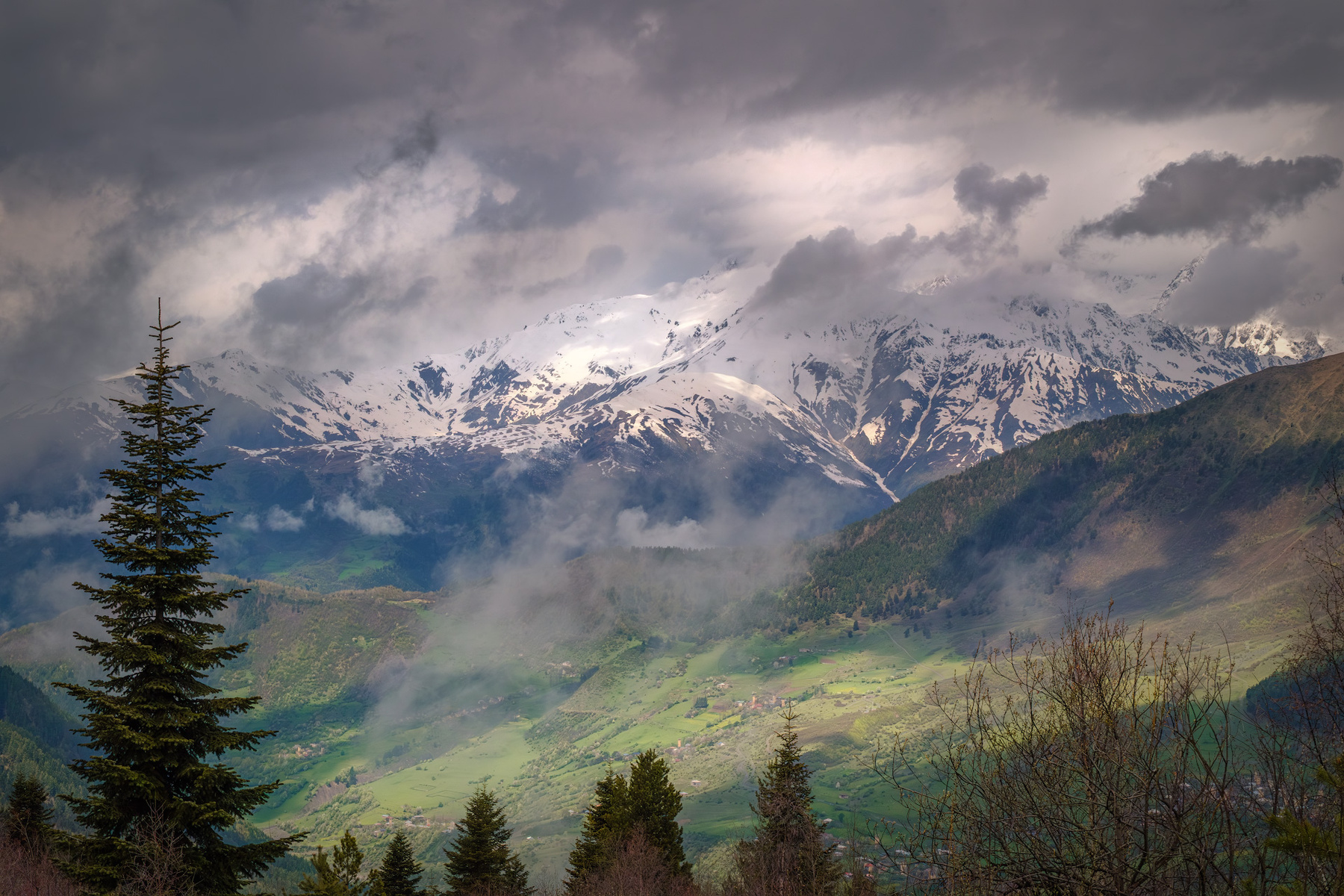 Spring View From Tetnuldi svaneti tetnuldi village mountains clouds spring forest peaks snow high landscape scenery travel outdoors georgia sakartvelo caucasus chizh