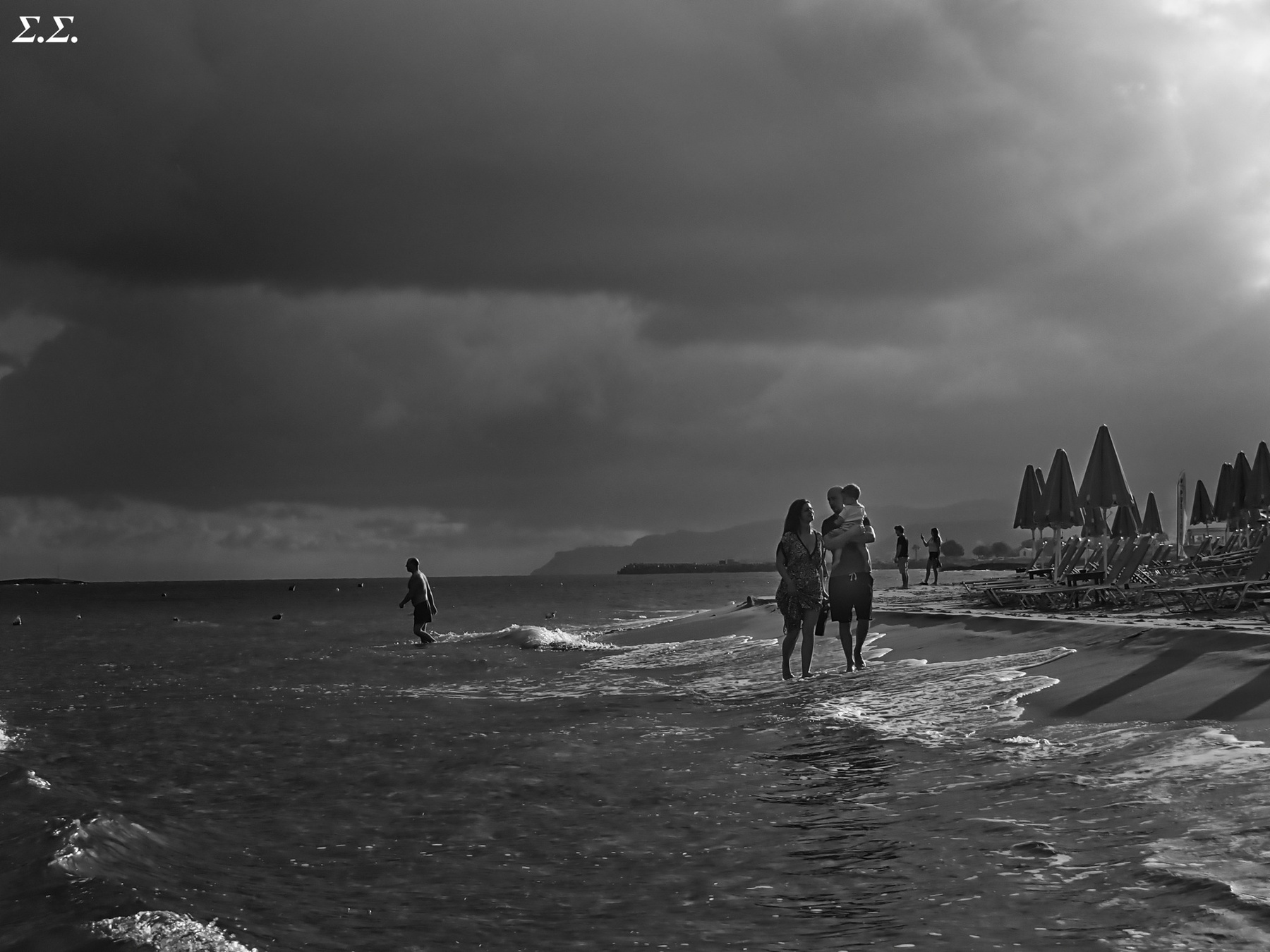 FAMILY AT THE CLOUDY AEGEAN BEACH 