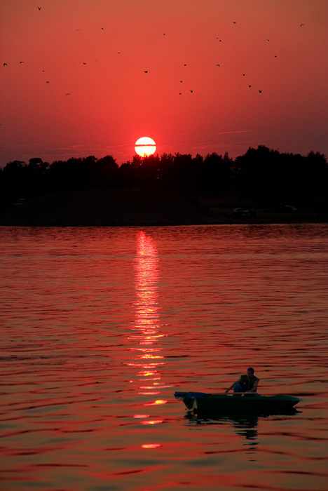 Fishing in dusk Sun set, boat, birds