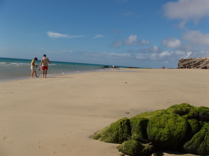 Playa Blanca, P.2 Canary Islands Fuertaventura Playa Blanca overview sand shore ocean green rock people