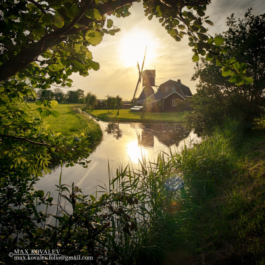 Устало солнце, нагулявшись за день. HDR,Holland,chanel,cloud,contre-jour,foliage,house,leaf,leaves,mill,sun,sunny,sunset,tree,village,water,wooden,Голландия,Европа,вода,деревня,дерево,деревянный,дом,закат,канал,контражур,лист,листва,листья,мельница,облако,солнечный,солнце