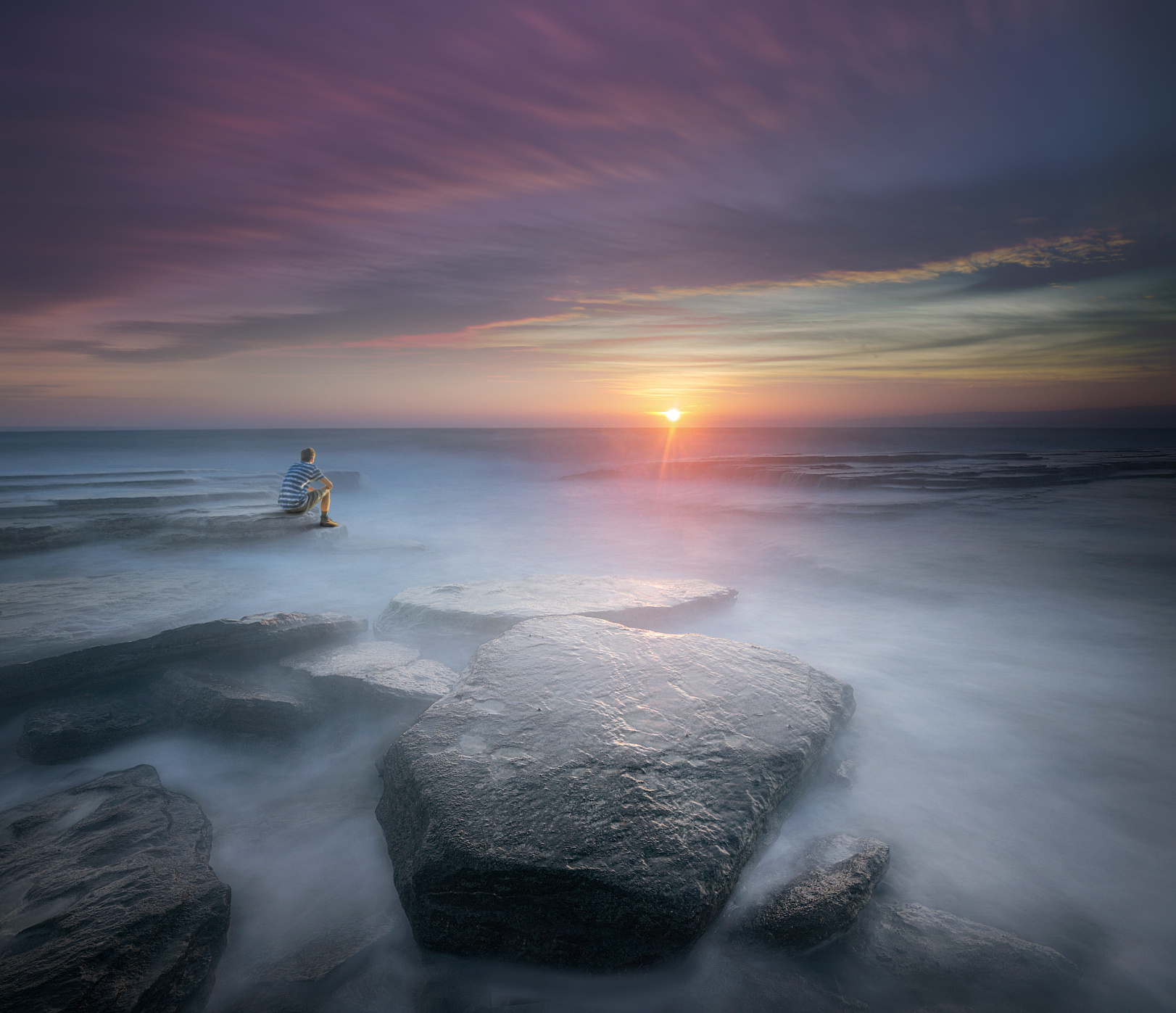 The Boy sunset boy long exposure sea ocean water clouds motion light sun colorful sao pedro de moel portugal