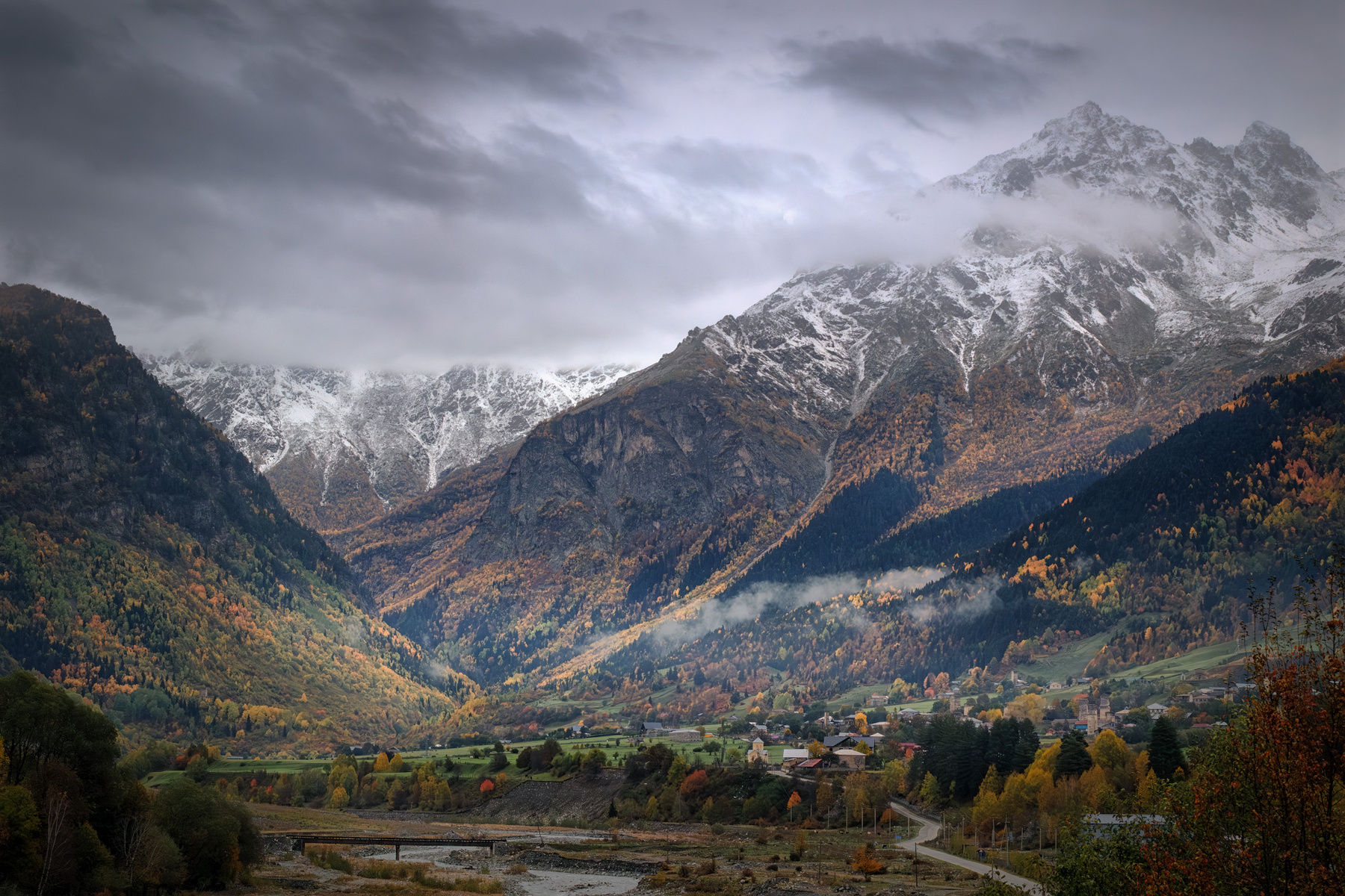 Under Mount Tetnuldi svaneti tetnuldi mulkhra river village rural mountains autumn fall forest peaks sky clouds high landscape scenery travel outdoors georgia sakartvelo caucasus chizh